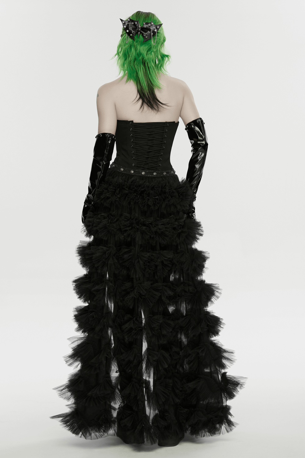 Punk Gothic Bat Wing Hair Clip with Spikes and Chains paired with edgy black outfit and green hair.