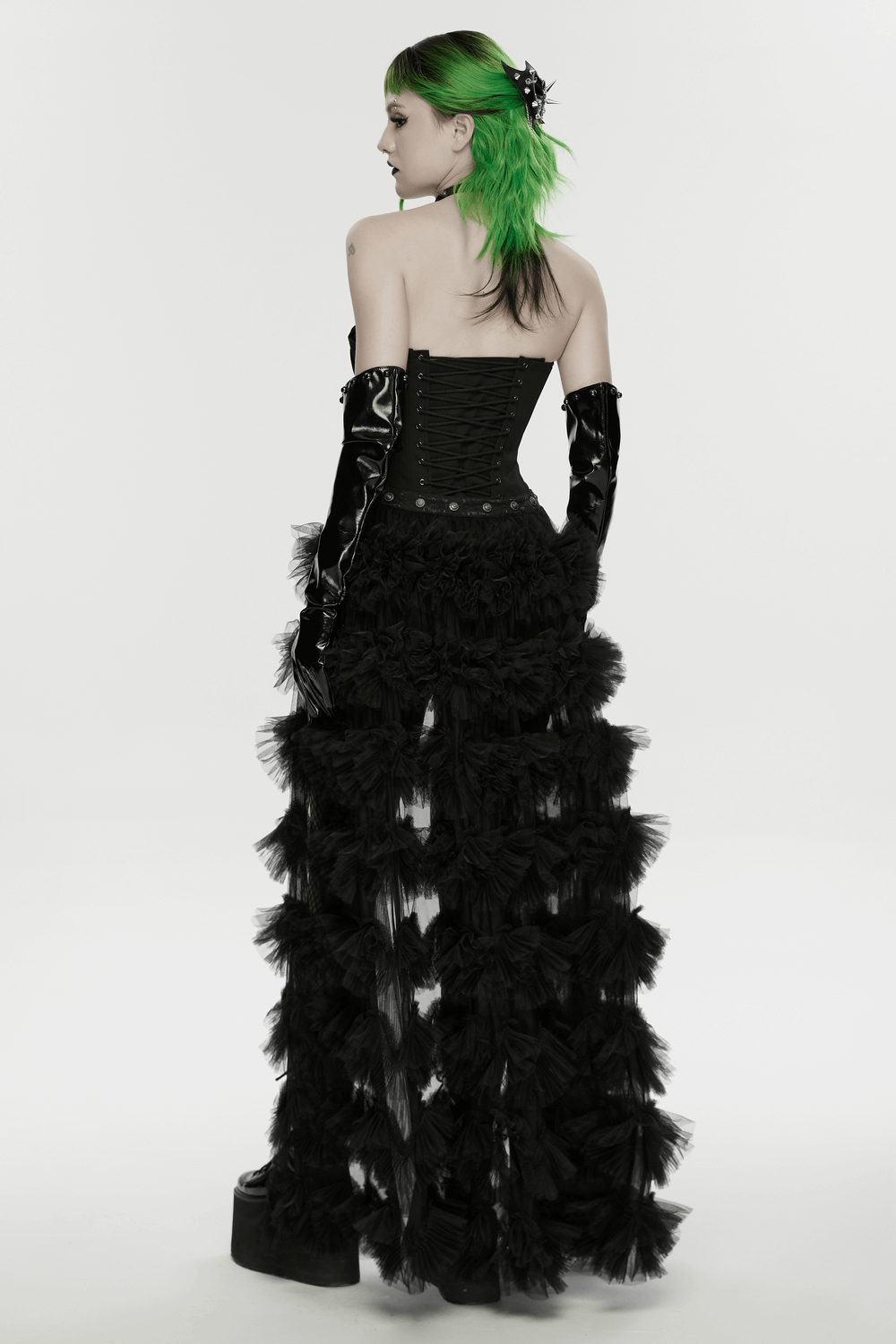 Punk Gothic Bat Wing Hair Clip with Spikes and Chains accessorizing a model in a dramatic black outfit.