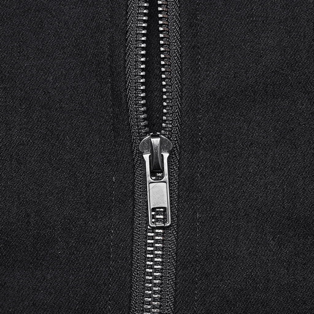 Close-up of a black zipper on punk gothic lace-up top, showcasing the metal detailing and durable design.