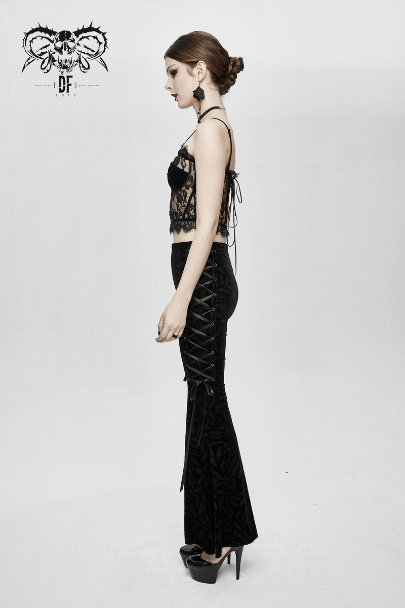 Model showcasing a punk-gothic black lace crop top with flared velvet pants in a stylish side pose.