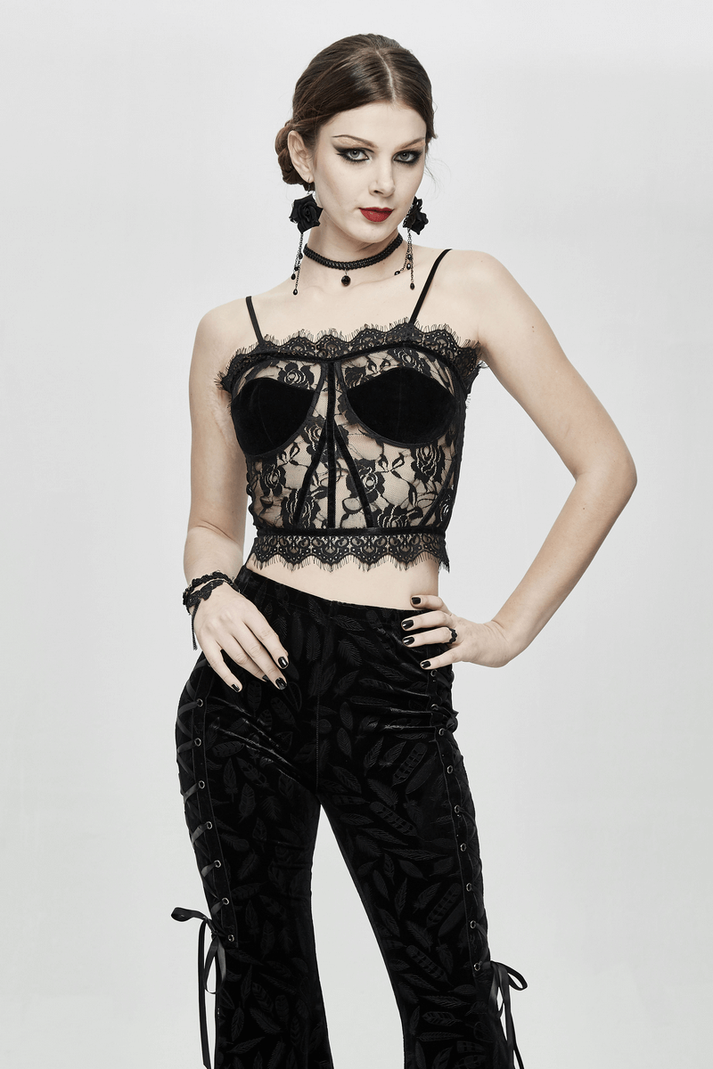 Stylish woman in a black lace corset crop top, showcasing gothic fashion and elegance with trendy accessories.