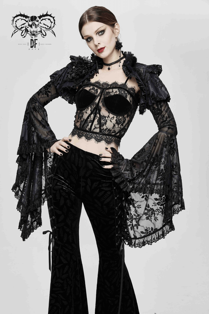 Gothic black lace crop top with flared sleeves, paired with stylish black pants for a punk-inspired look.