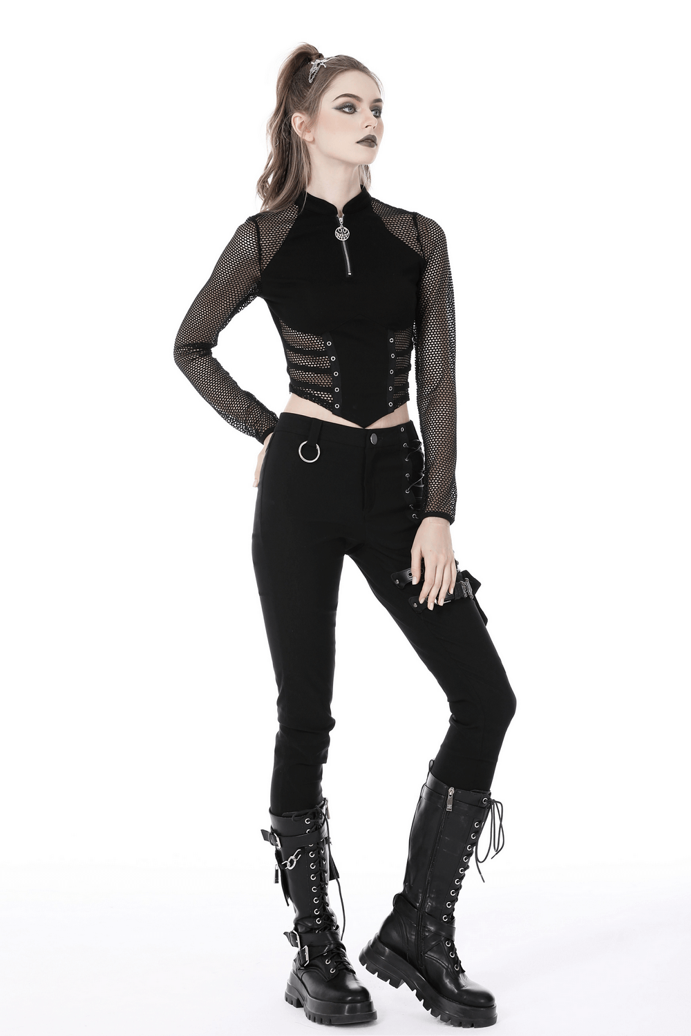 Punk gothic zip-up mesh crop top with long sleeves styled with black pants and combat boots.