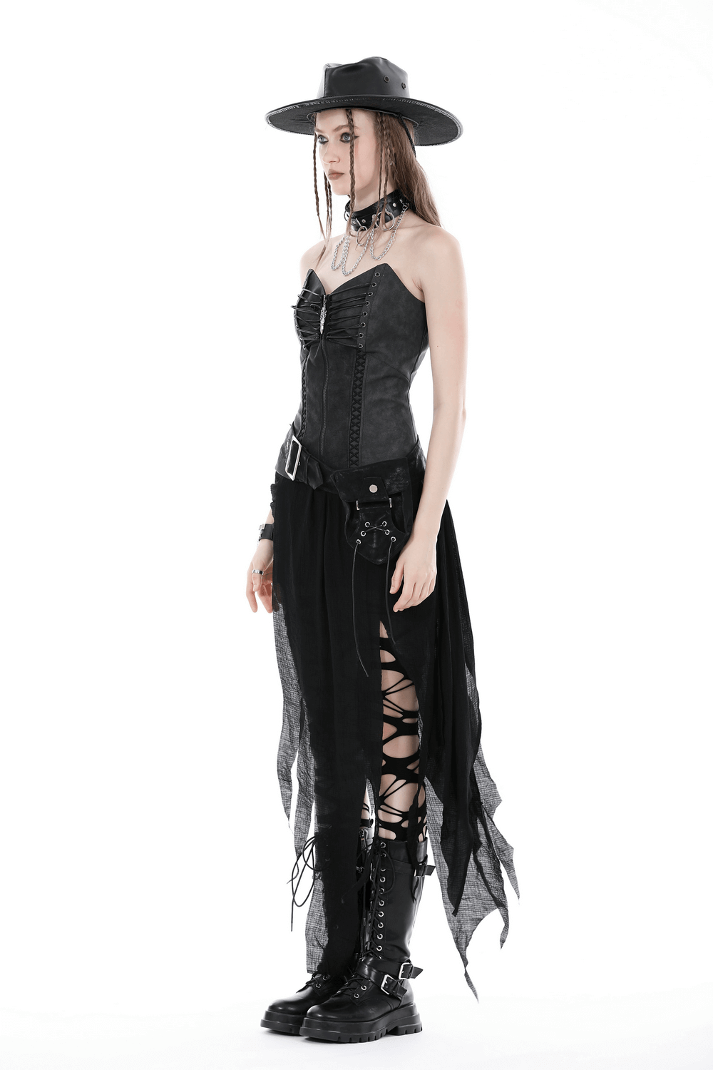 Gothic punk model in asymmetrical black skirt, corset top, and edgy accessories, showcasing a dramatic high-low style.
