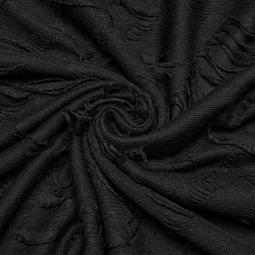 Close-up of black tattered fabric, showcasing a textured design perfect for punk fashion.