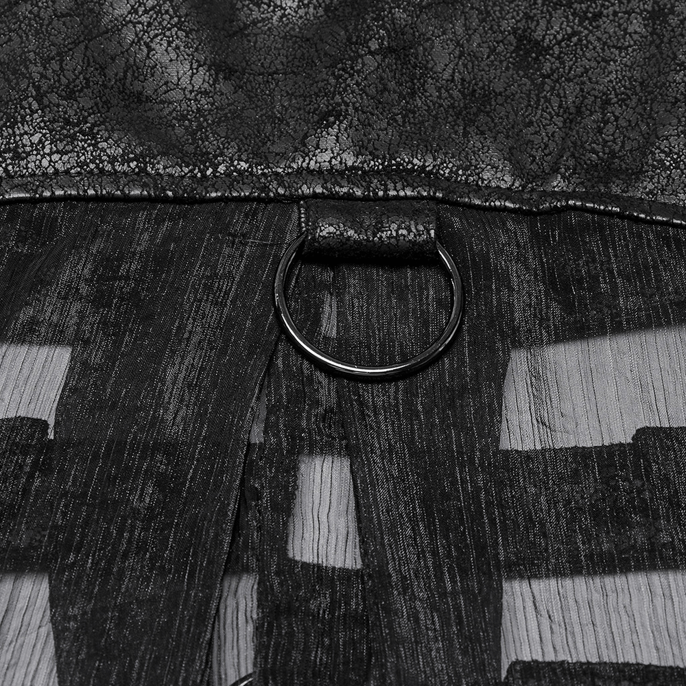 Close-up of punk hooded skeleton cape detail, featuring a metal ring and textured fabric.