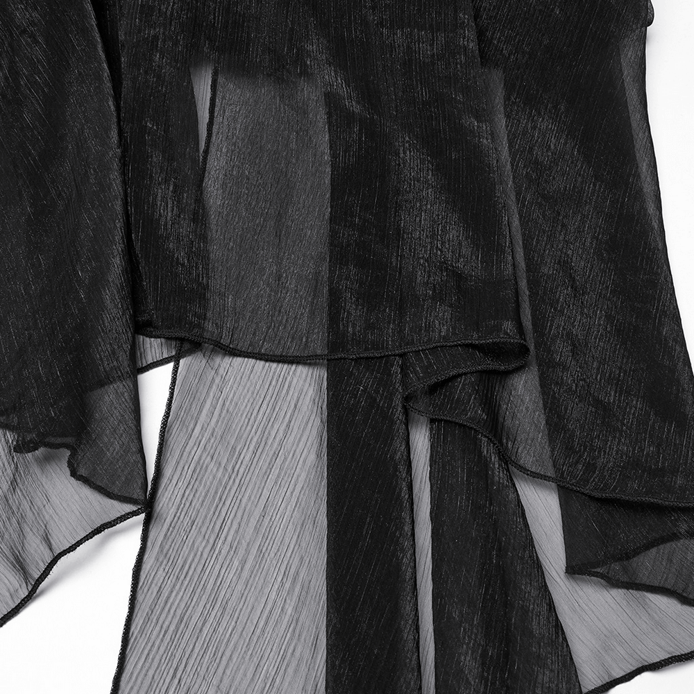 Close-up of a sheer black fabric featuring textured chiffon layers, ideal for punk-inspired fashion.