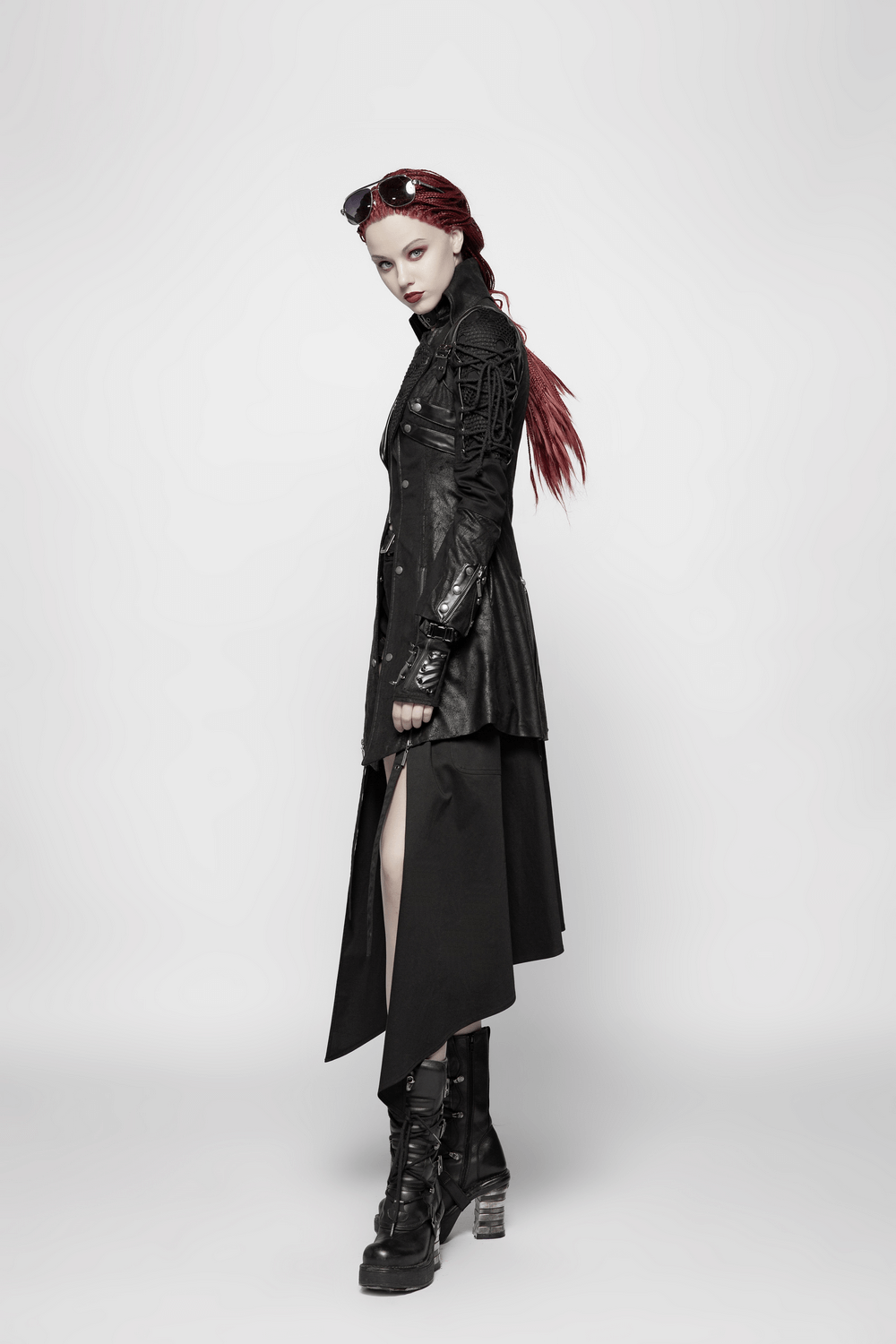 Punk-inspired black rubber coat with lace details, showcasing edgy style and bold fashion elements.