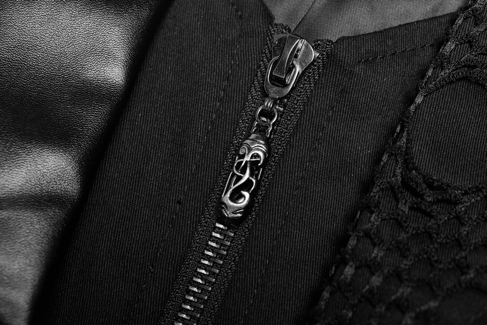 Close-up of a stylish black zipper on a punk-inspired coat with unique lace detailing.