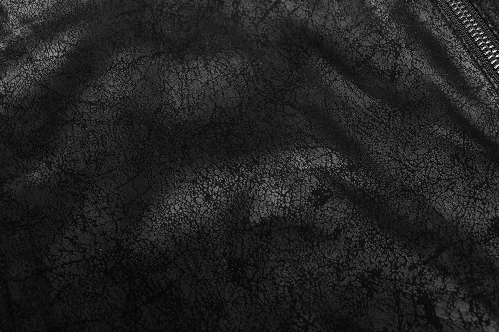 Close-up of edgy black rubberized coat texture with intricate crackle detail.
