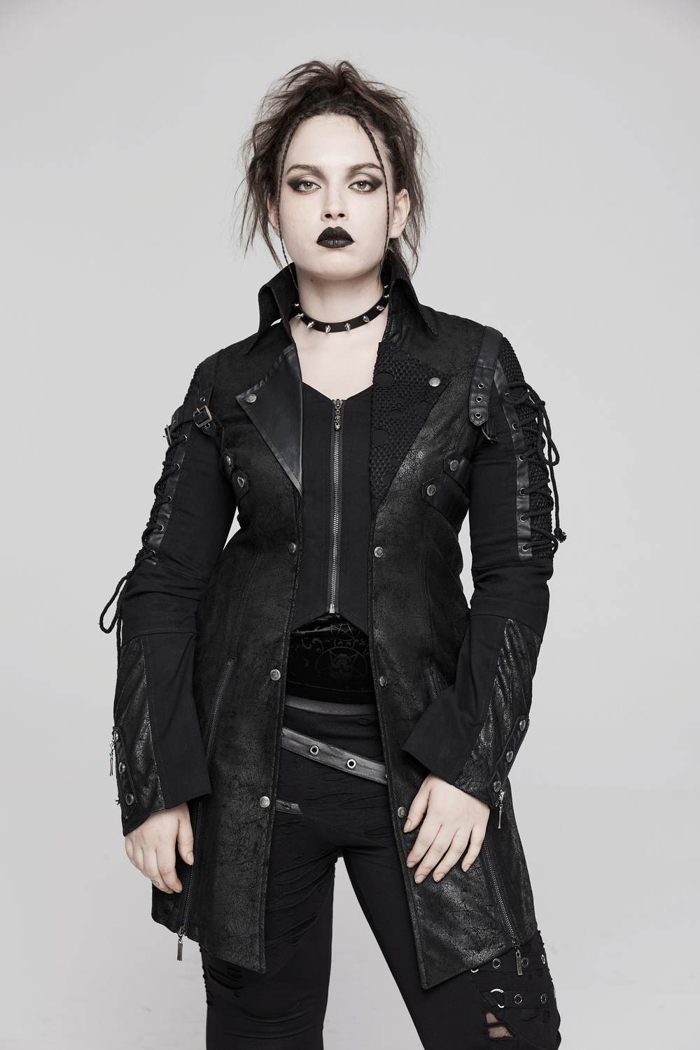 Punk-inspired black rubber long-sleeved coat with lace detail, perfect for a bold and edgy fashion statement.