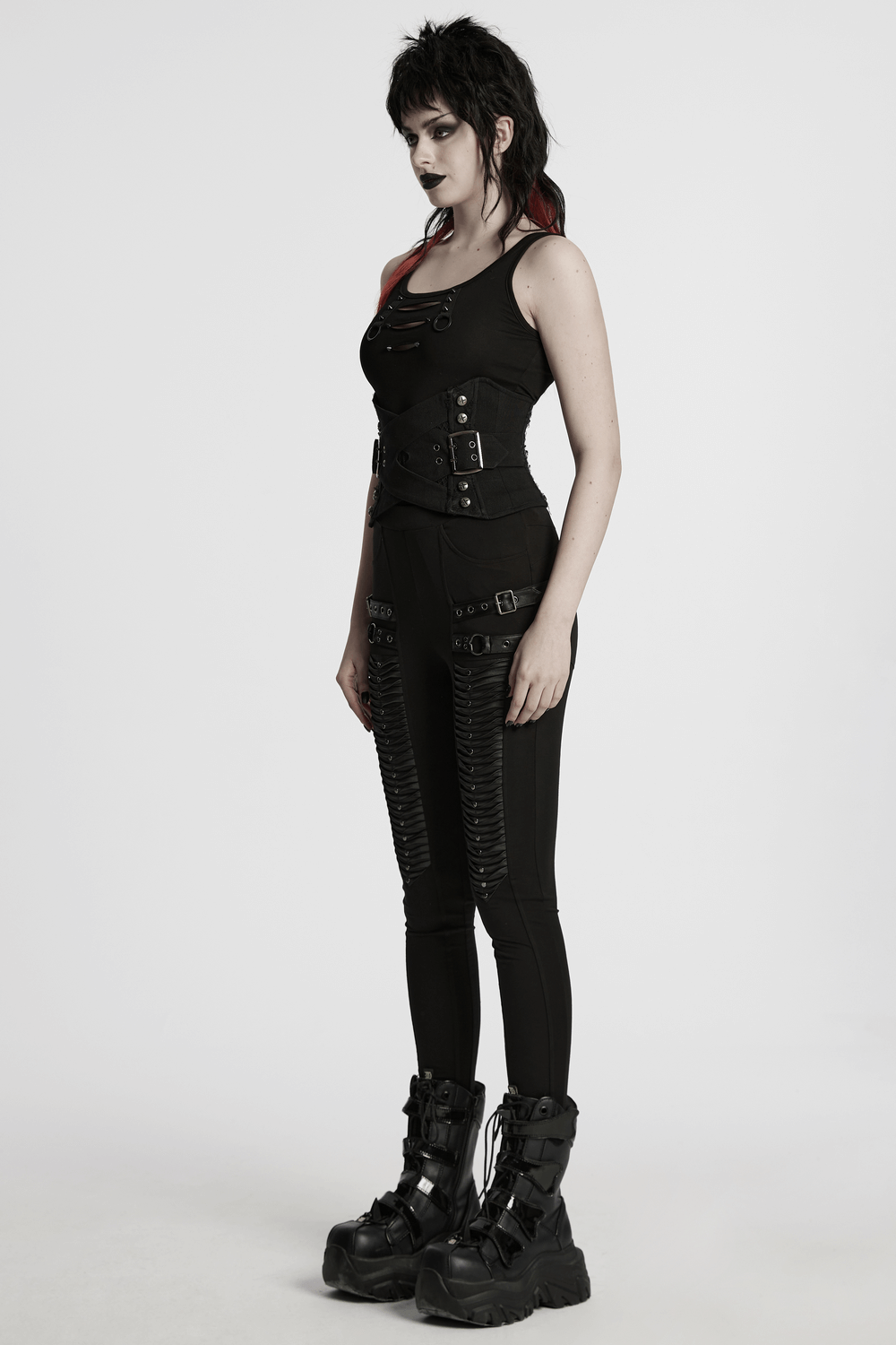 Gothic model wearing a black punk interlaced corset belt with metal studs and zip, showcasing edgy fashion.
