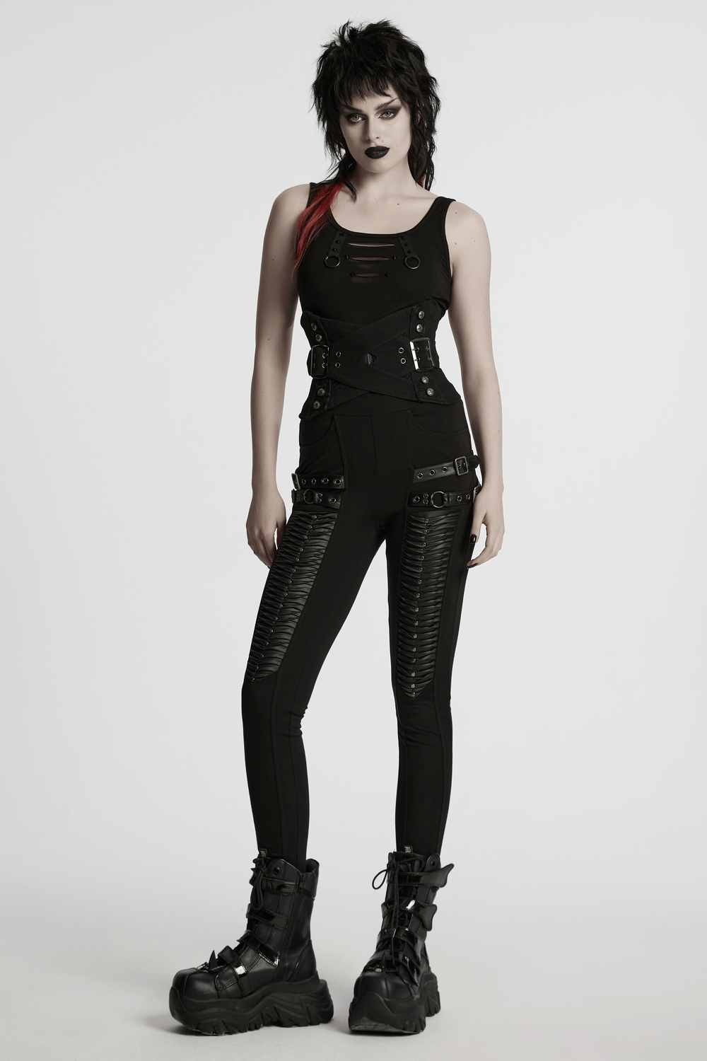 Gothic punk model showcasing a black corset outfit with studs and buckles, perfect for edgy fashion statements.