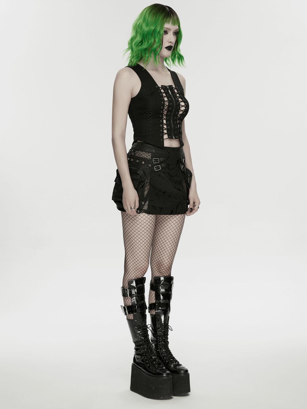 Punk Lace Up Mesh Vest with Eyelets and Split Front showcased with edgy accessories and stylish platform boots.