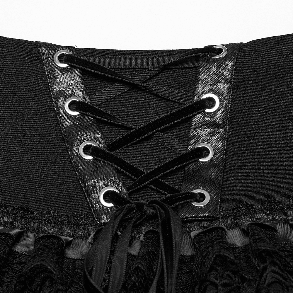 Close-up of lace-up detailing on a punk skirt, featuring faux leather and mesh textures for an edgy style.