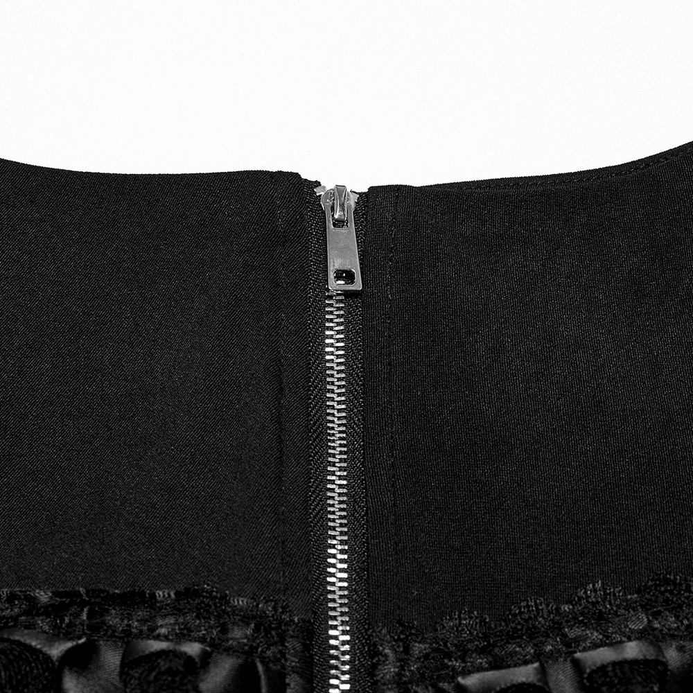 Close-up of the side zipper on a punk lace-up skirt, showcasing stylish faux leather detail.