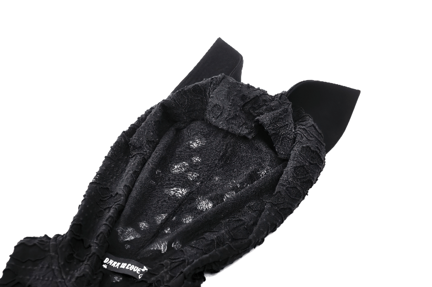 Close-up of the hood of a black lace dress featuring cat ears and intricate lace detailing.