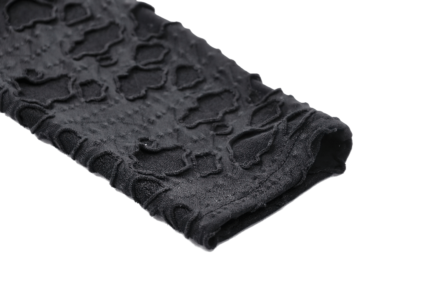 Black lace fabric detail showcasing intricate patterns for a punk-inspired look.