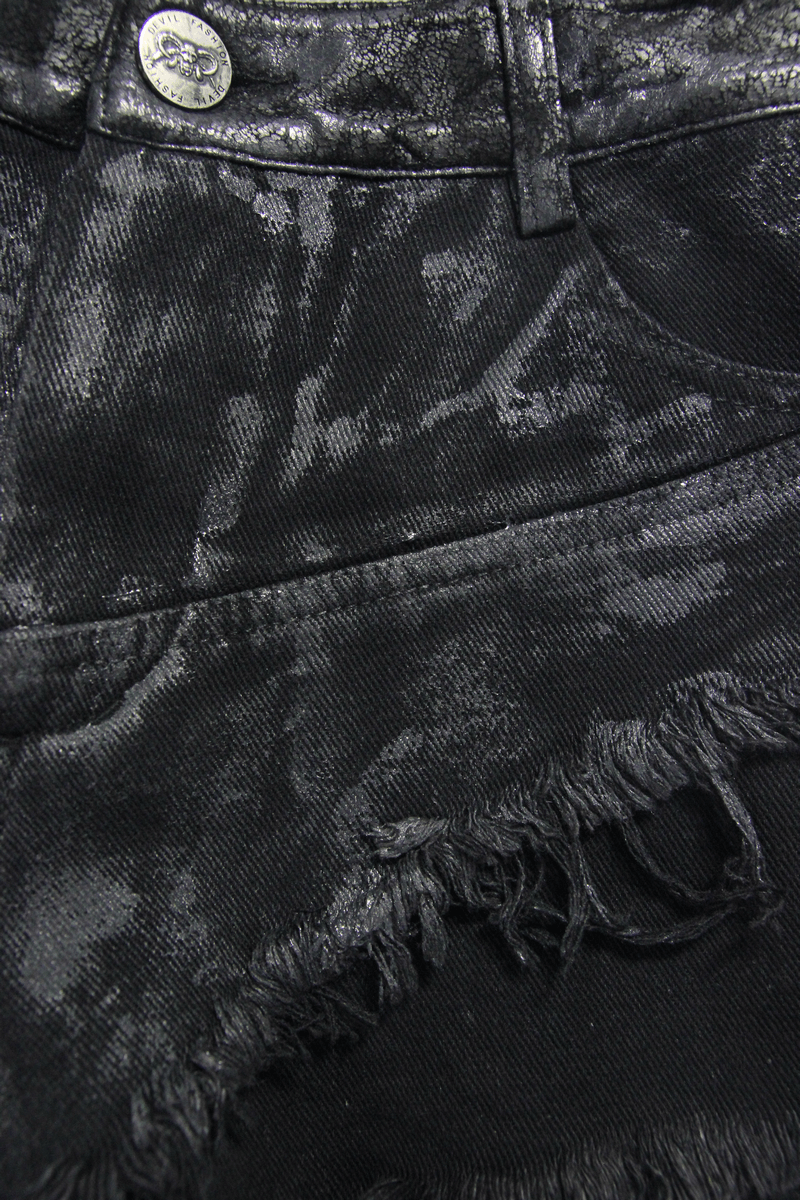 Close-up of black ripped punk shorts showcasing the distressed design and quality fabric texture.