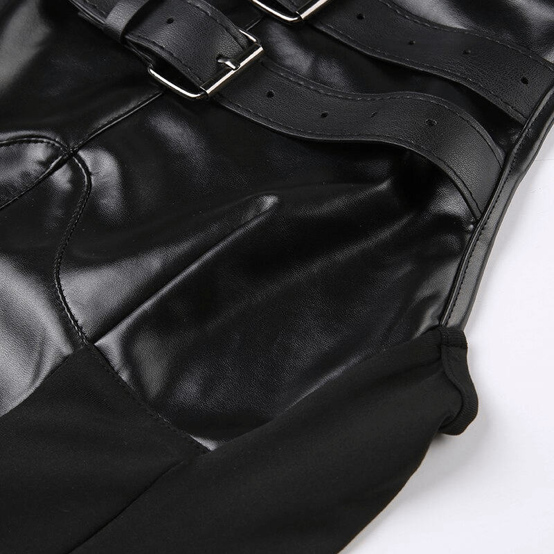 Close-up of black leather buckle design on women's punk crop top, showcasing edgy patchwork style.