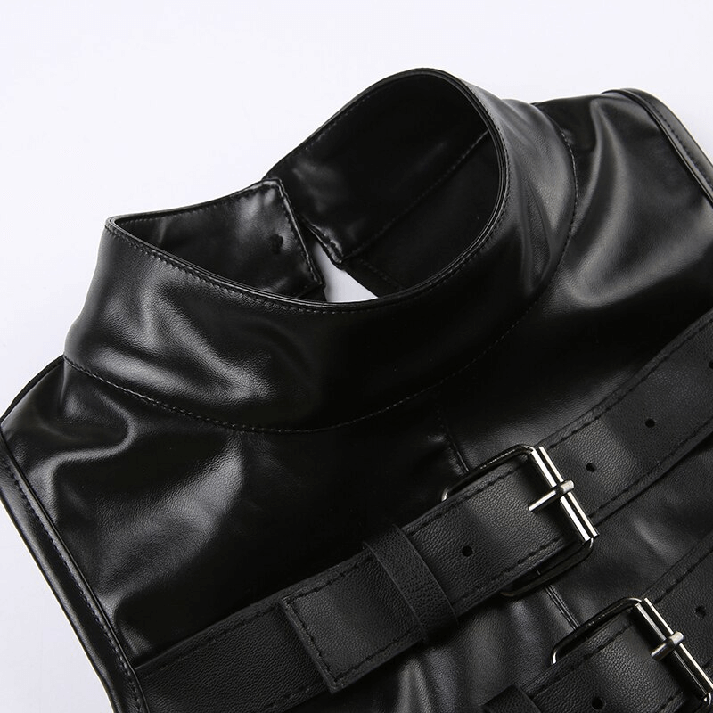 Close-up of punk women's sleeveless patchwork crop top with leather buckle design and high collar