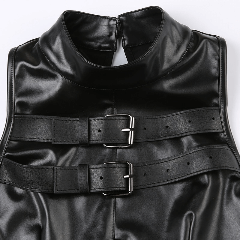 Close-up of black punk women's sleeveless patchwork crop top with leather buckle design.
