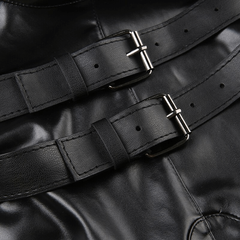 Close-up of black leather buckles on a punk women's sleeveless patchwork crop top, showcasing unique design details.