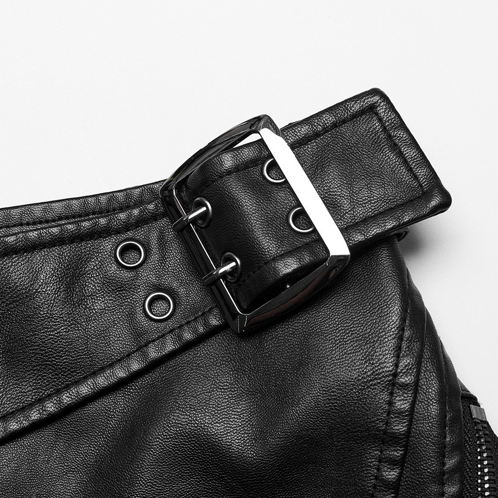 Close-up of the stylish buckle detail on a punk leather mini skirt with mesh panels.