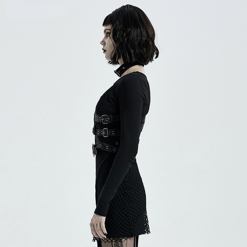 Gothic punk leather shoulder body harness with asymmetric straps, metal accents, and python buckle on a model in a black outfit.