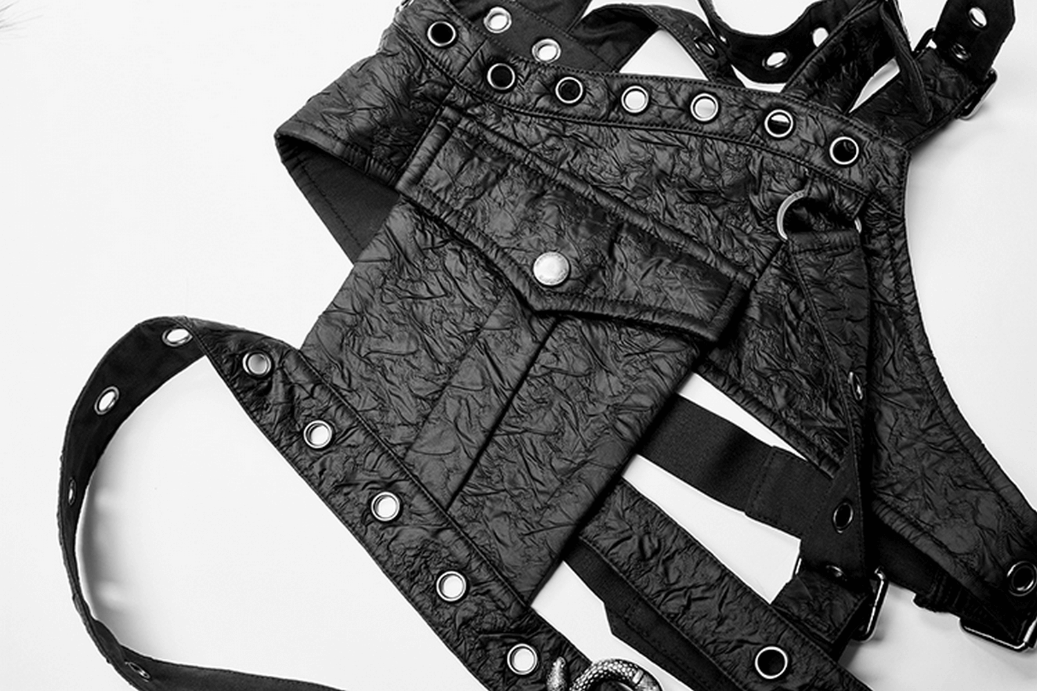 Punk leather shoulder body harness with metal accents, featuring a decorative pocket and python buckle, exuding gothic allure.