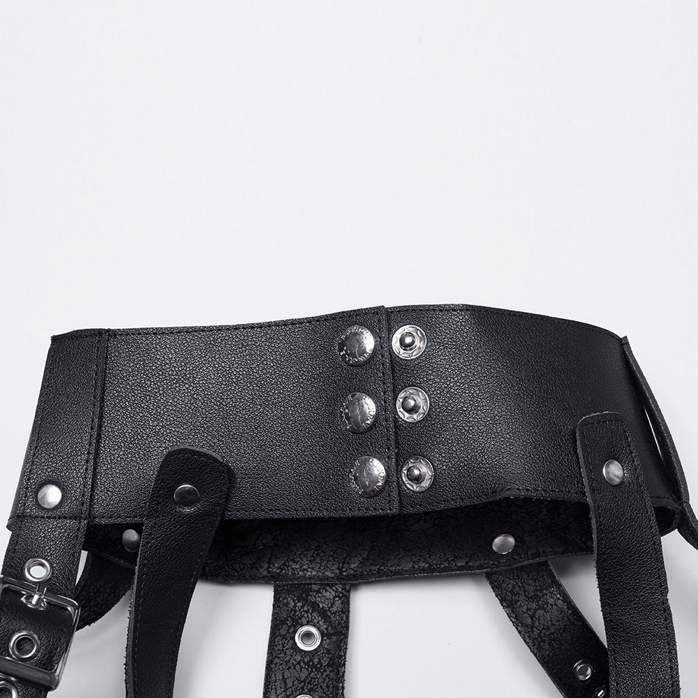 Edgy black punk leather shoulder armor with silver snaps and straps for a bold, gothic fashion statement.