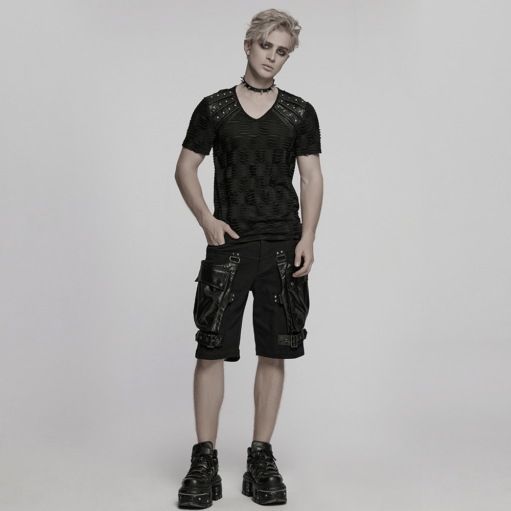 Punk leather trimmed black shorts with oversized pockets, paired with a stylish black top and edgy footwear.