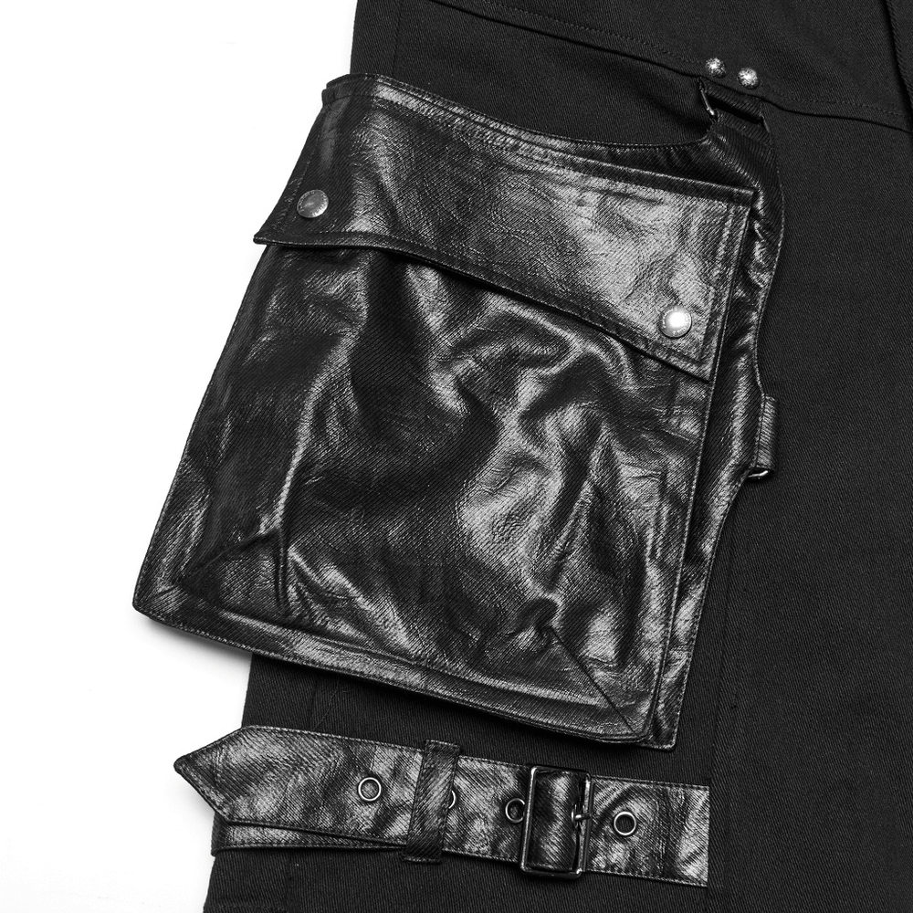 Close-up of punk black shorts featuring a stylish oversized leather pocket and belt detailing.