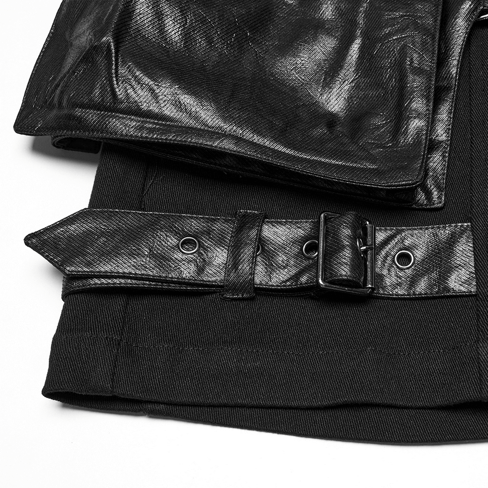 Punk leather trimmed black shorts with oversized pockets and stylish belt detail.