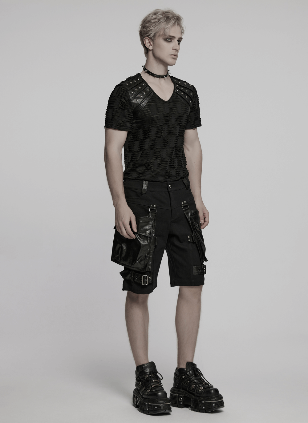 Stylish punk leather trimmed black shorts with oversized pockets, perfect for edgy street fashion.