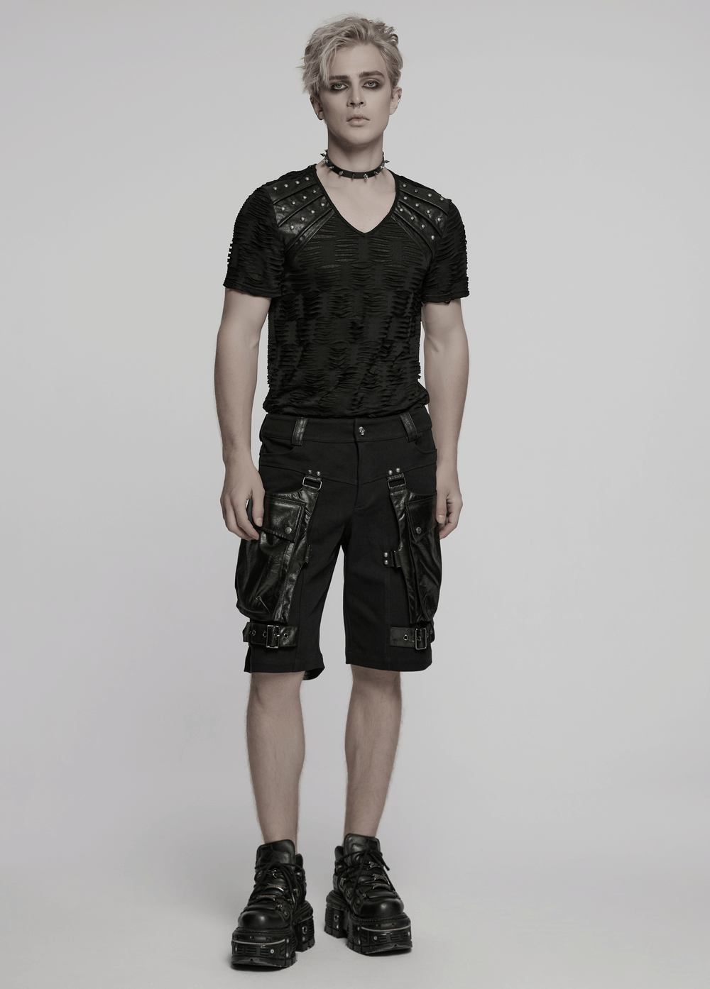 Punk leather trimmed black shorts with oversized pockets, styled for a bold, edgy look.
