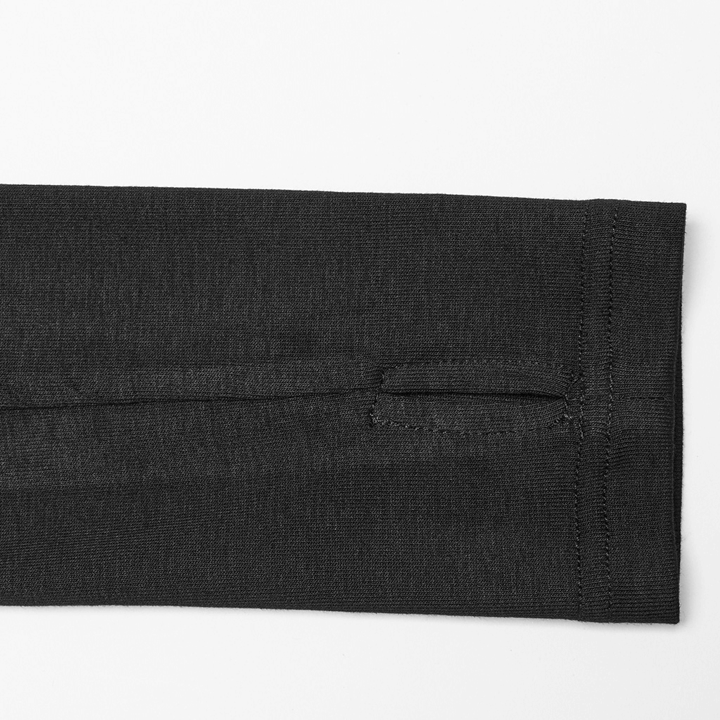 Close-up of long sleeve fabric with finger hole detail for a minimalist punk top, showcasing stretchy material.