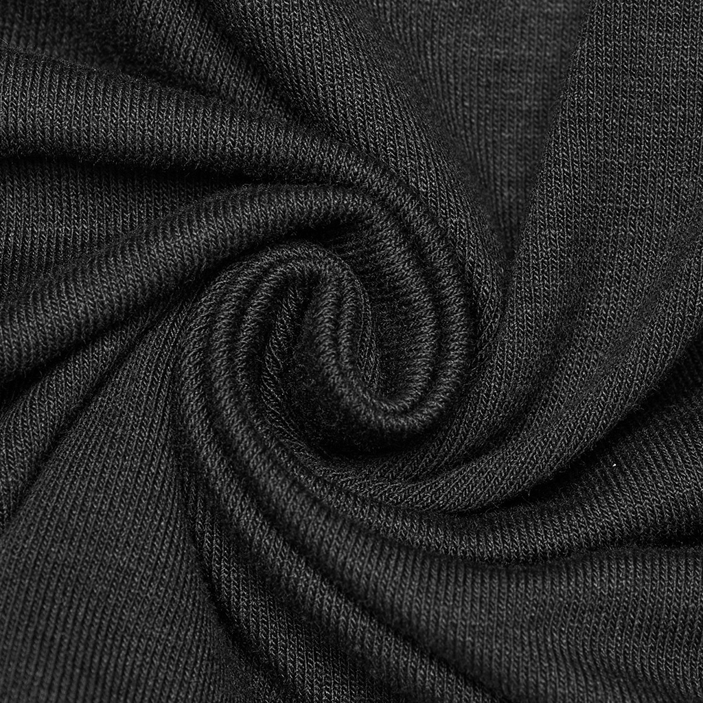 Close-up of soft, stretchy black fabric, highlighting the texture for a minimalist punk style.