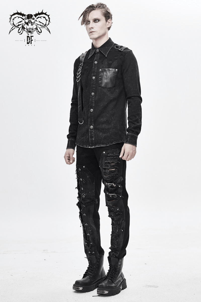 Punk men's black shirt with PU leather flaps, torn mesh, and rivets, styled with edgy black trousers.