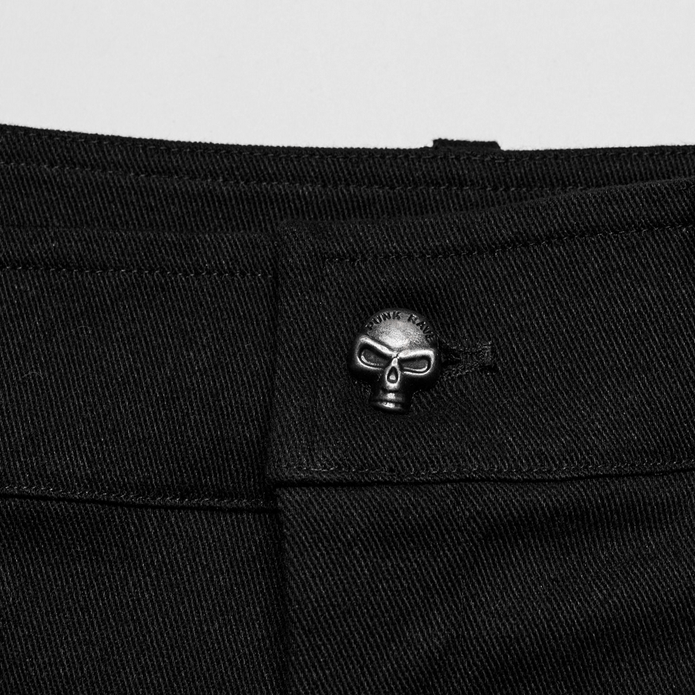 Close-up of punk men's black twill pants showing a skull button accent for a stylish edge.
