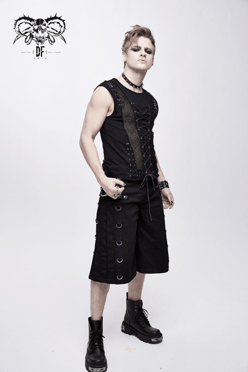 Punk men's black tank top with drawstring and mesh, styled with black shorts and boots, exuding a gothic vibe.