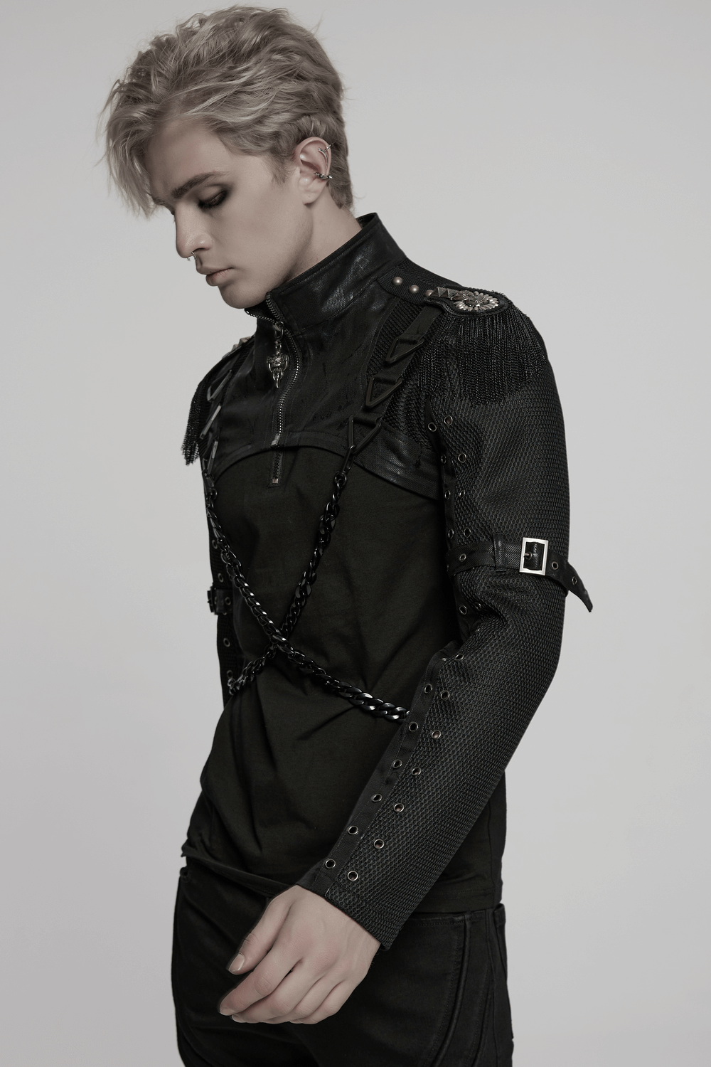 Model wearing a punk mesh cropped jacket with chains and buckle details for edgy alternative fashion.
