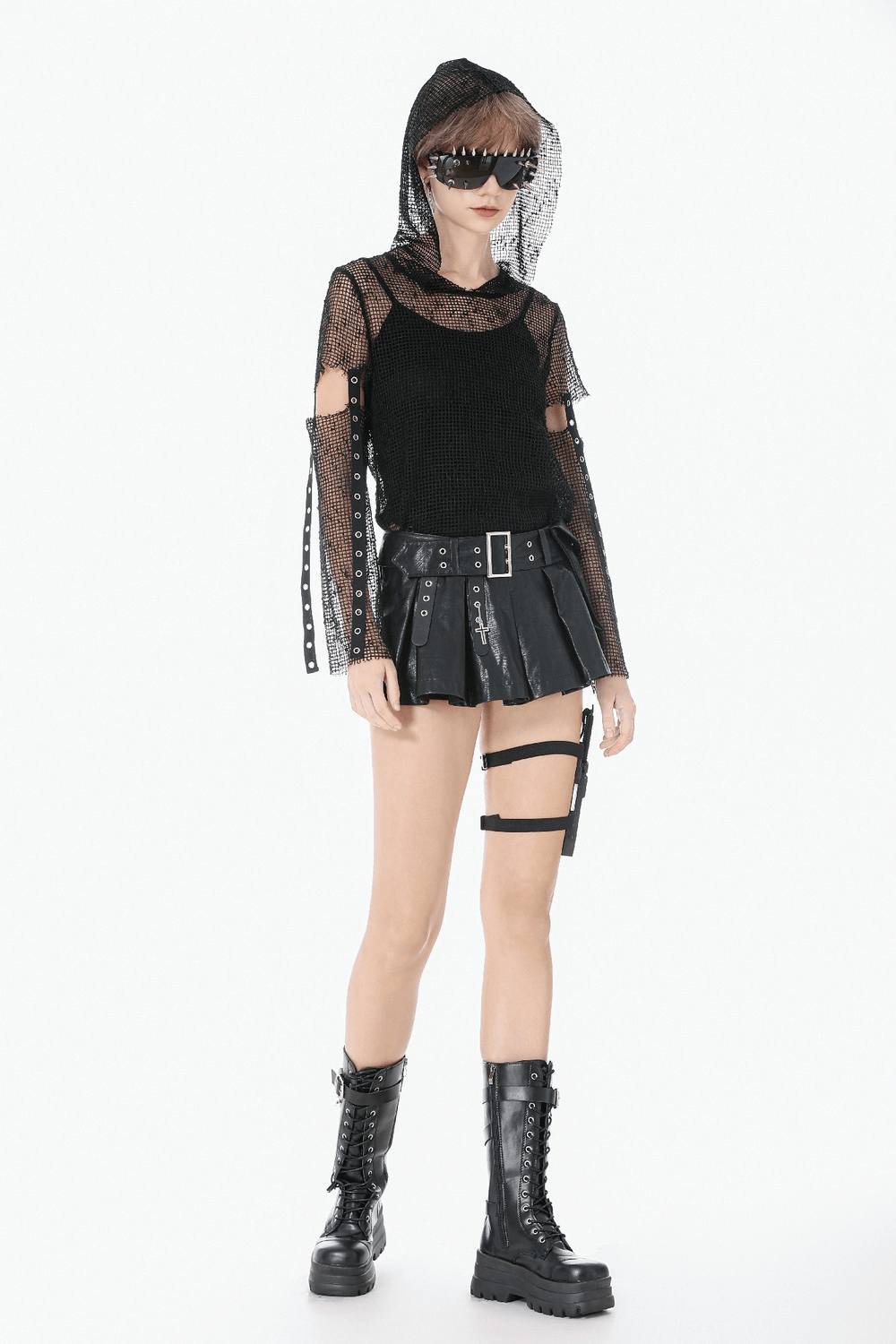 Punk Mesh Hood Top with Arm Warmers and Eyelet Straps styled with a black skirt and combat boots, exuding gothic vibes.