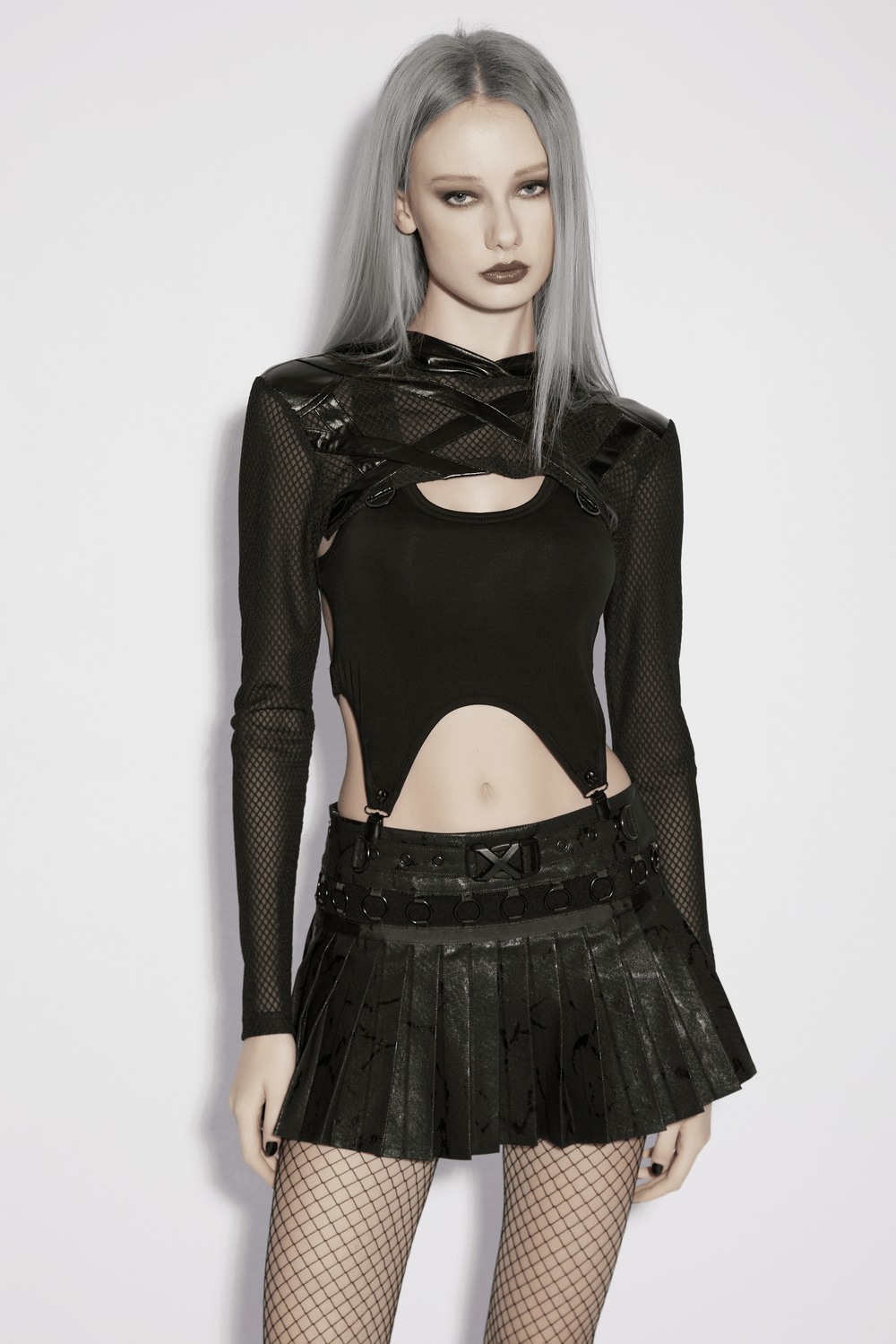 Punk Mesh Hooded Crop Top with Rubberized Panels worn with a black pleated skirt and fishnet tights.