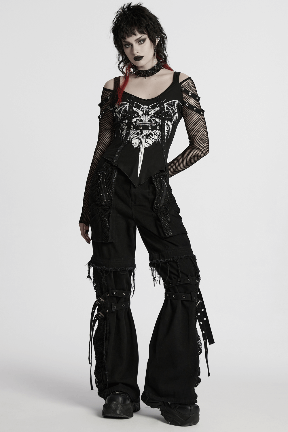 Model wearing a punk gothic top with bat skull print and mesh sleeves, styled with edgy baggy pants and accessories.