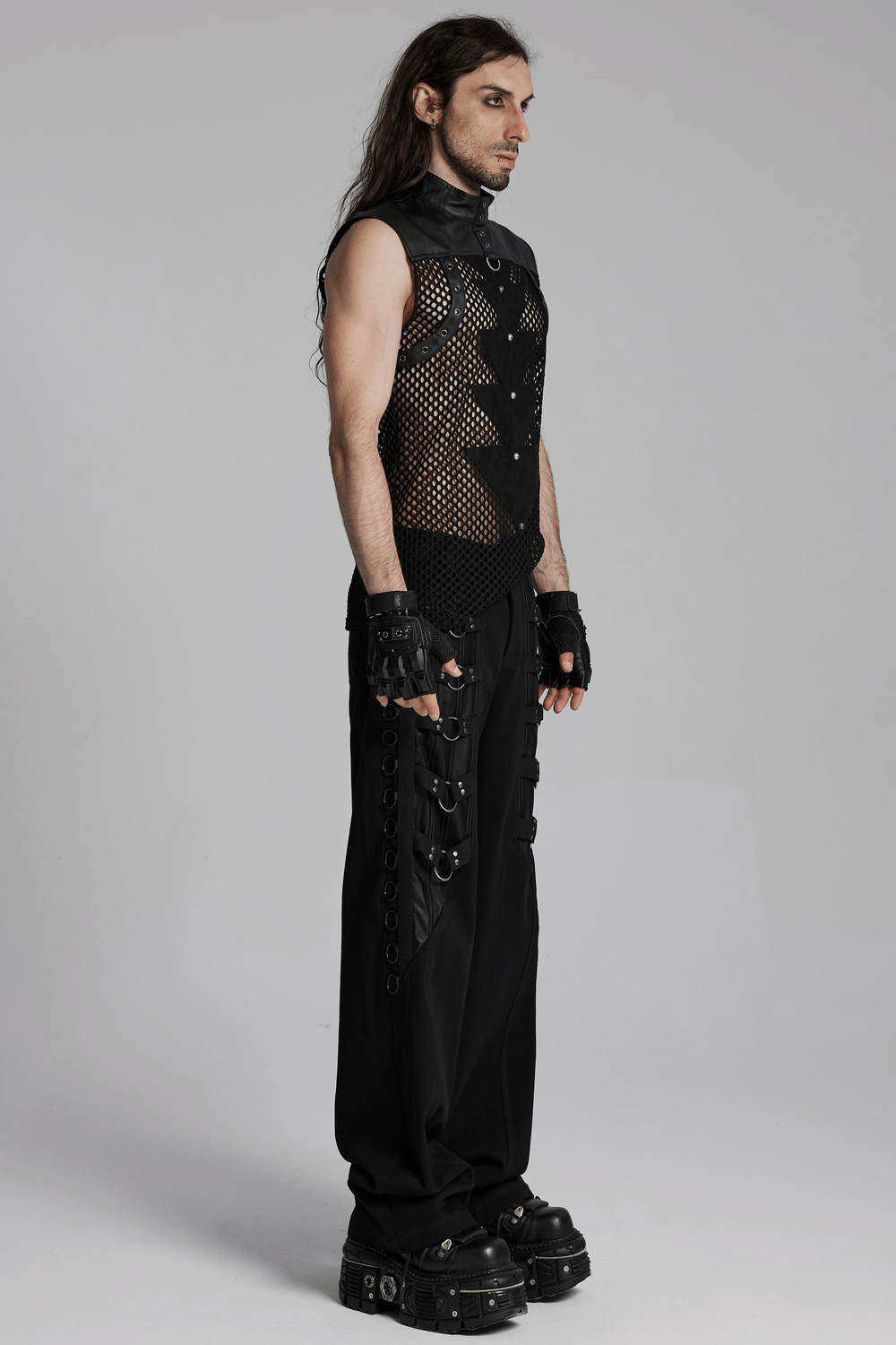 Punk mesh sleeveless top with leather details, showcased on model in edgy black outfit, highlighting unique design and accessories.