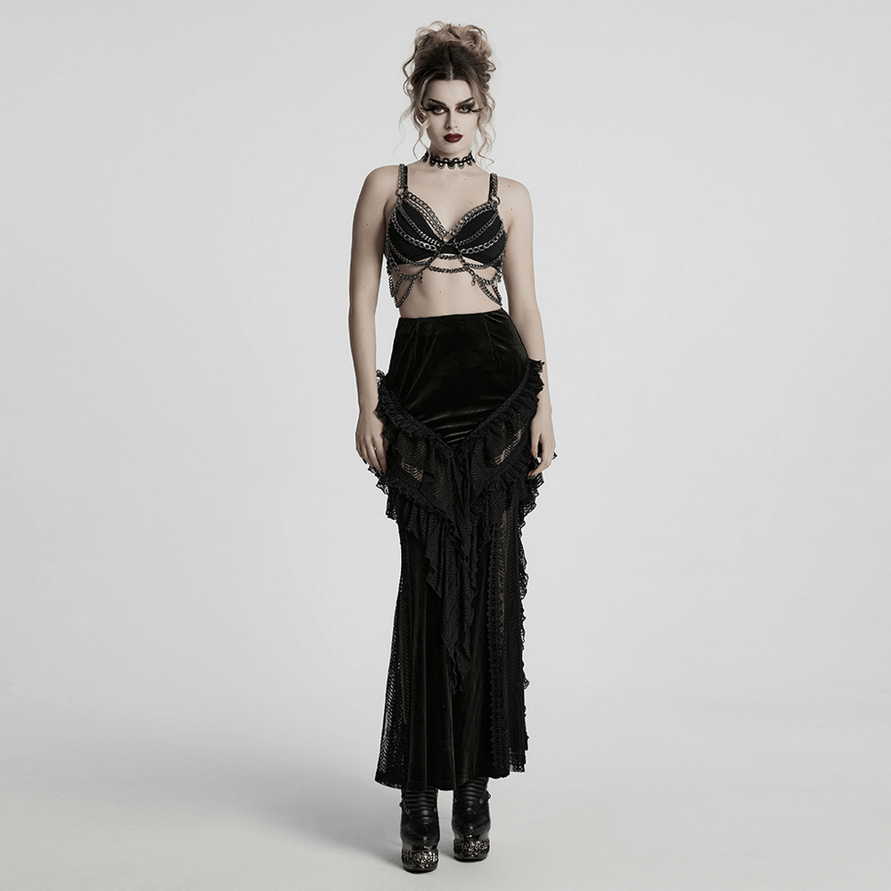 Model in punk metal chain body harness dress, showcasing alternative fashion with adjustable chains and gothic style.
