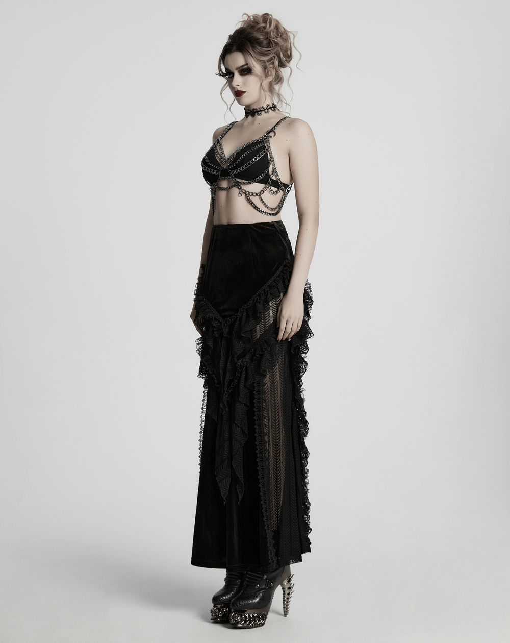 Punk metal chain body harness dress showcasing edgy alternative fashion with adjustable chains and a layered skirt.