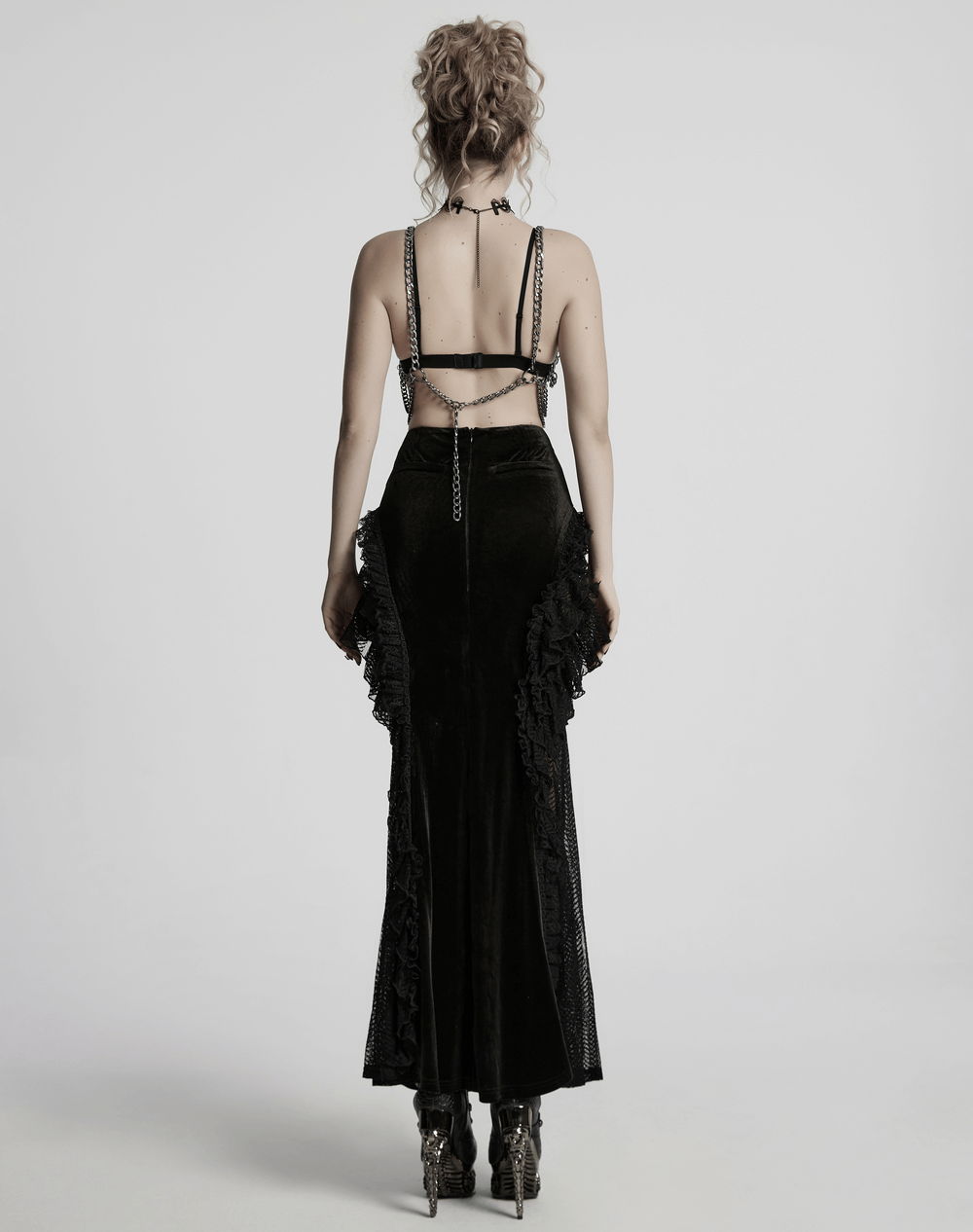 Back view of a Punk Metal Chain Body Harness Dress featuring adjustable chains and stylish ruffles for alternative fashion.