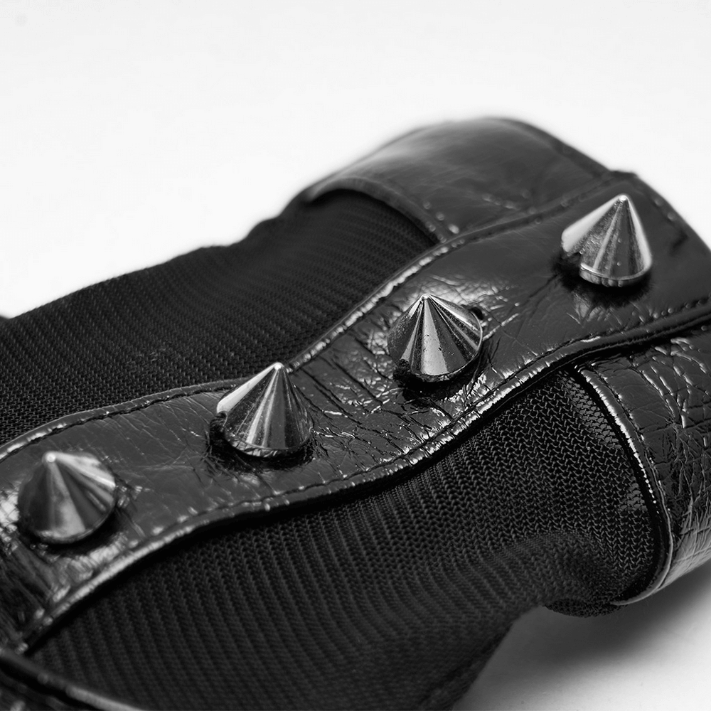 Close-up of punk metal rivet PU leather gloves showcasing glossy texture and striking pointed conenails details.